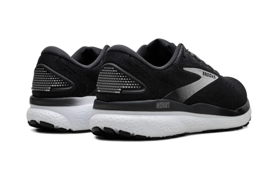 Black running shoes with visible 'Brooks' logo on a white background